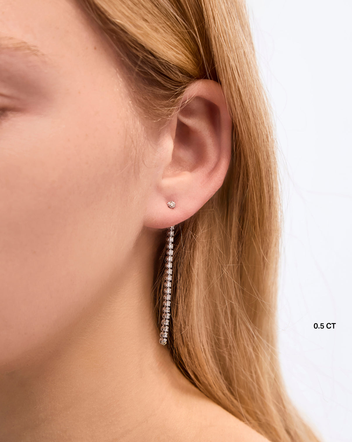 Tennis Trio Earrings 0.5 carat styled solo on model in the back of ear