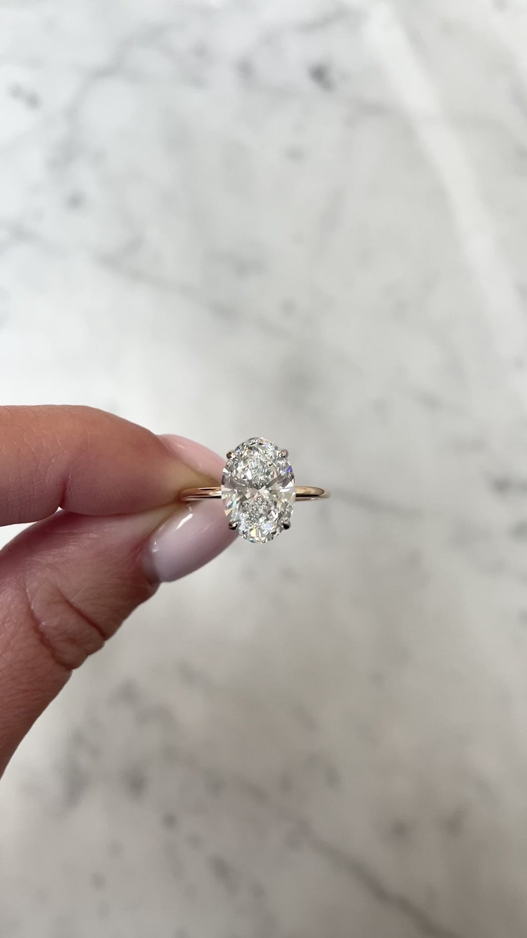 Oval Lab Diamond in Whisper Thin® hand holding ring video