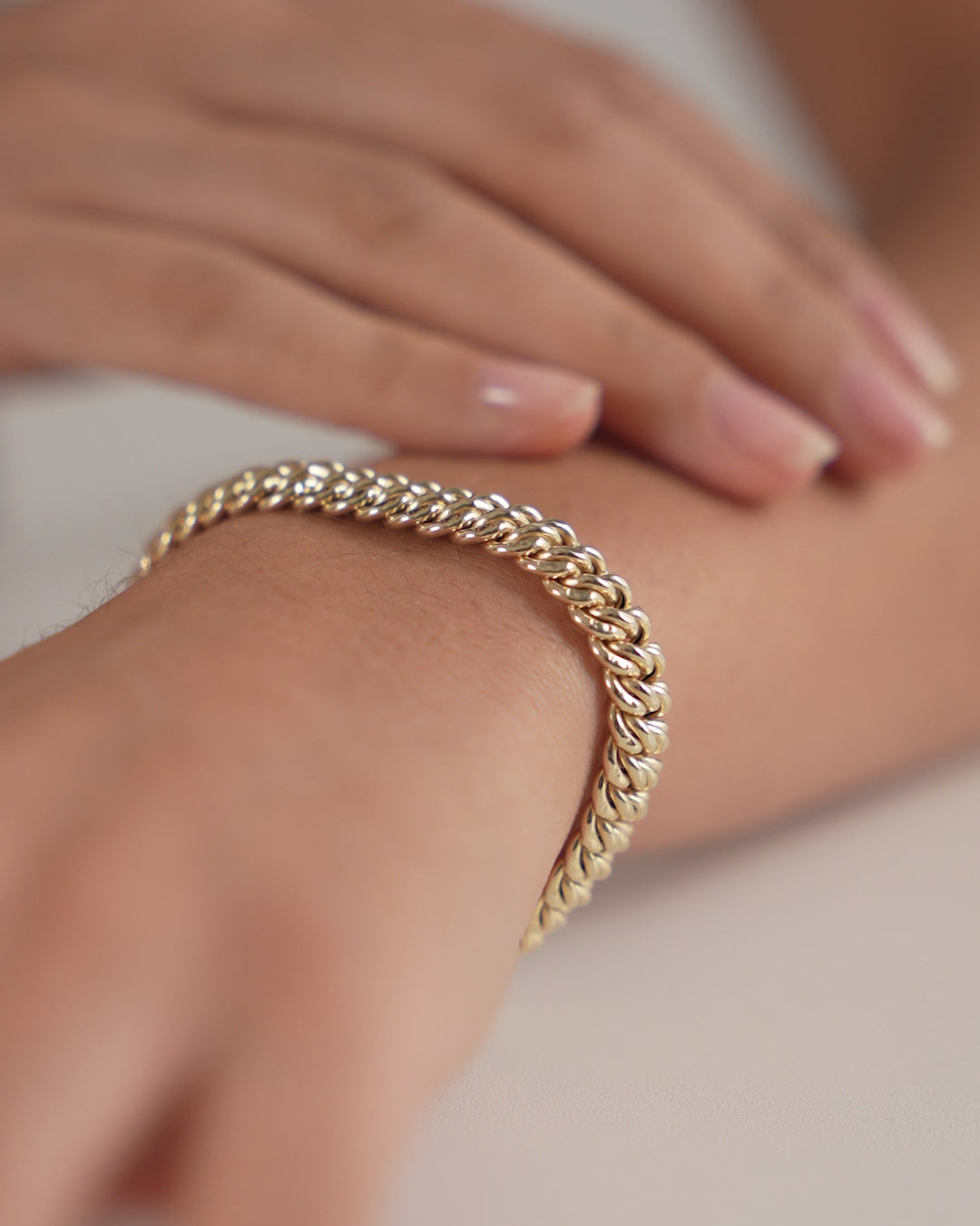Ring Concierge Bold Gold Braided Chain Bracelet 14k Yellow Gold - video showing product detail and stacked with other gold bracelets