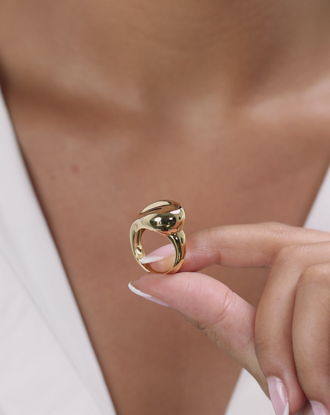 Video of Melted Pebble Ring being worn, demonstrating how the organic gold design moves and catches light