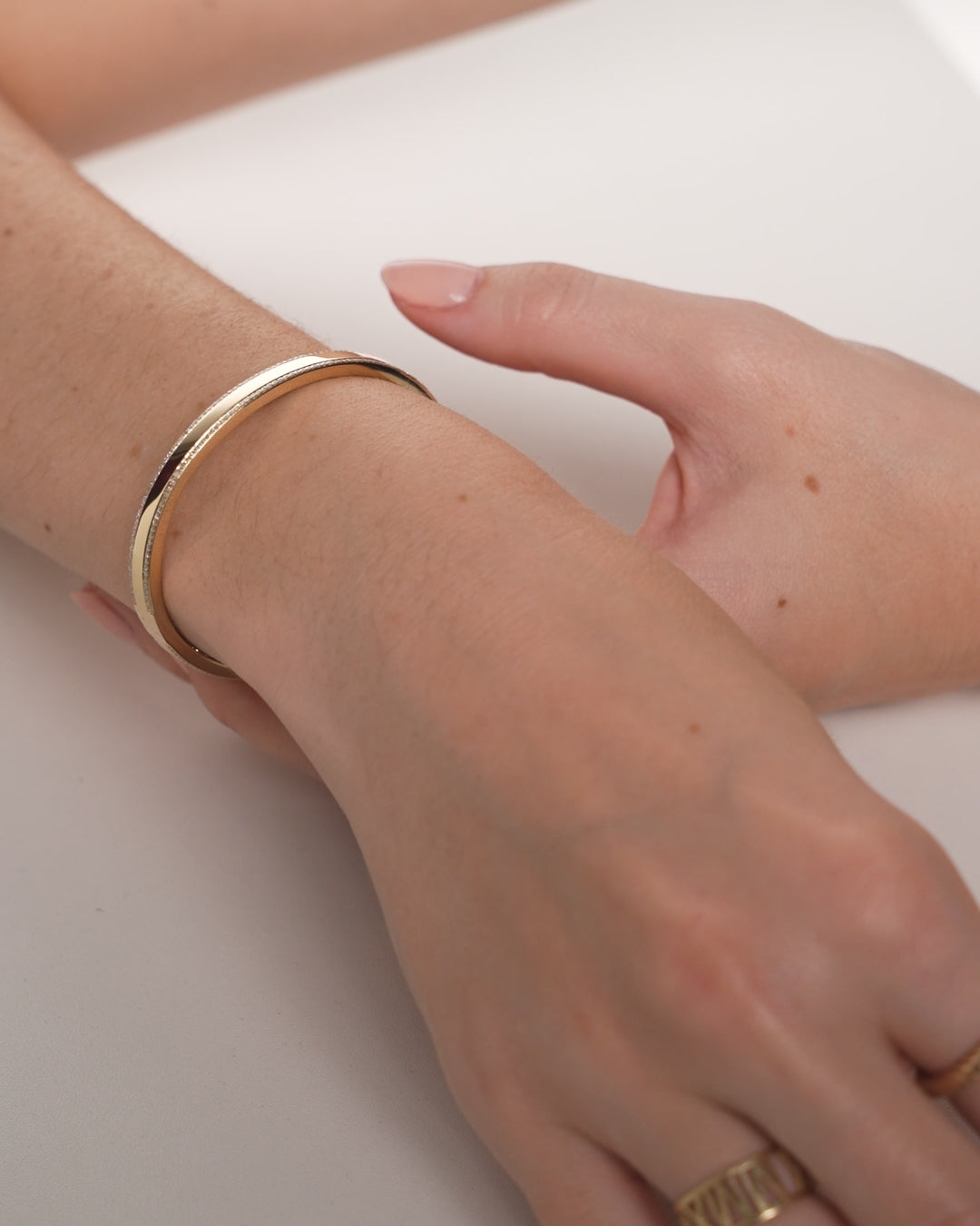 Video of Diamond Border Bangle shown styled with other bracelets and bangles on wrists of models