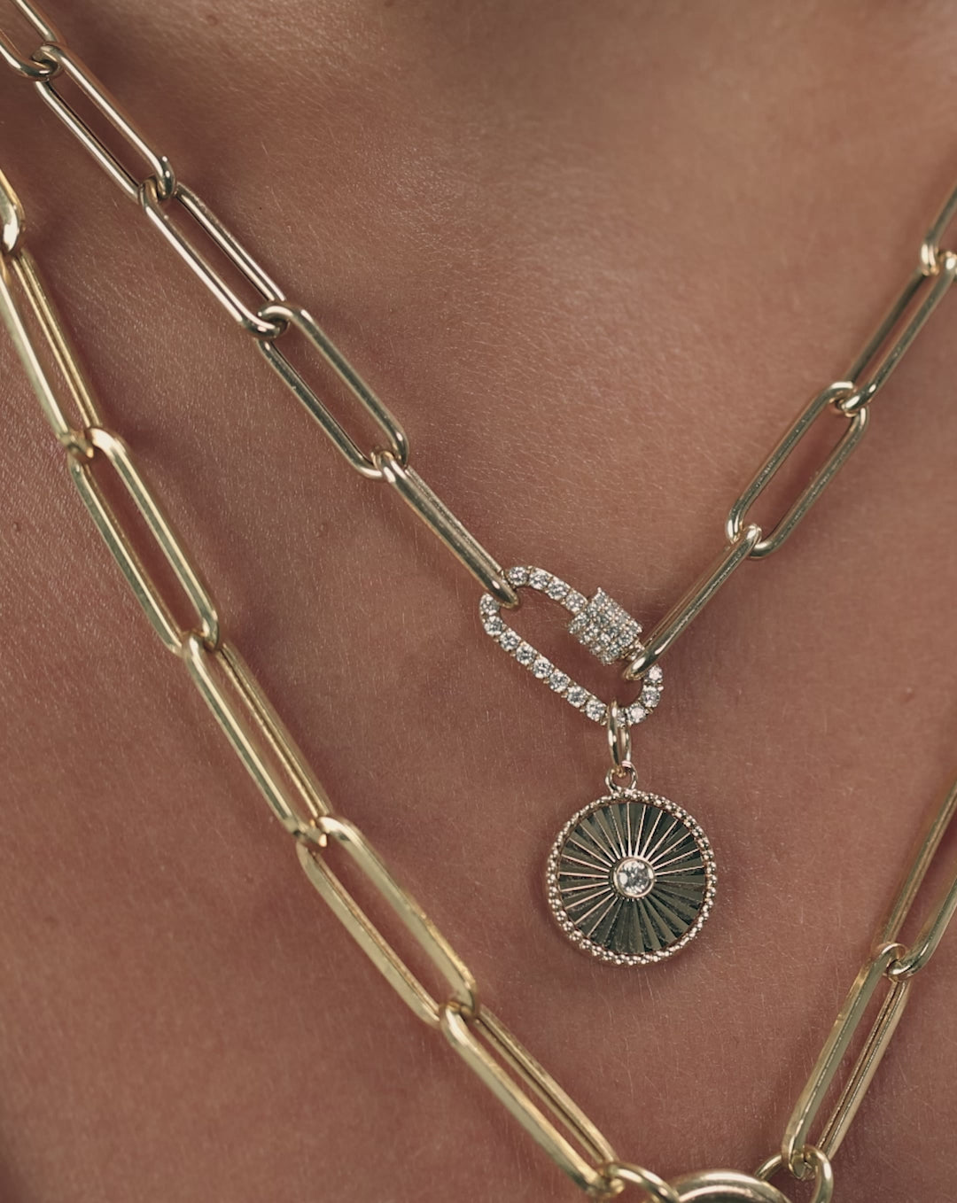 Video showcasing 14k gold fluted round pendant with diamonds, highlighting textured surface and sparkle