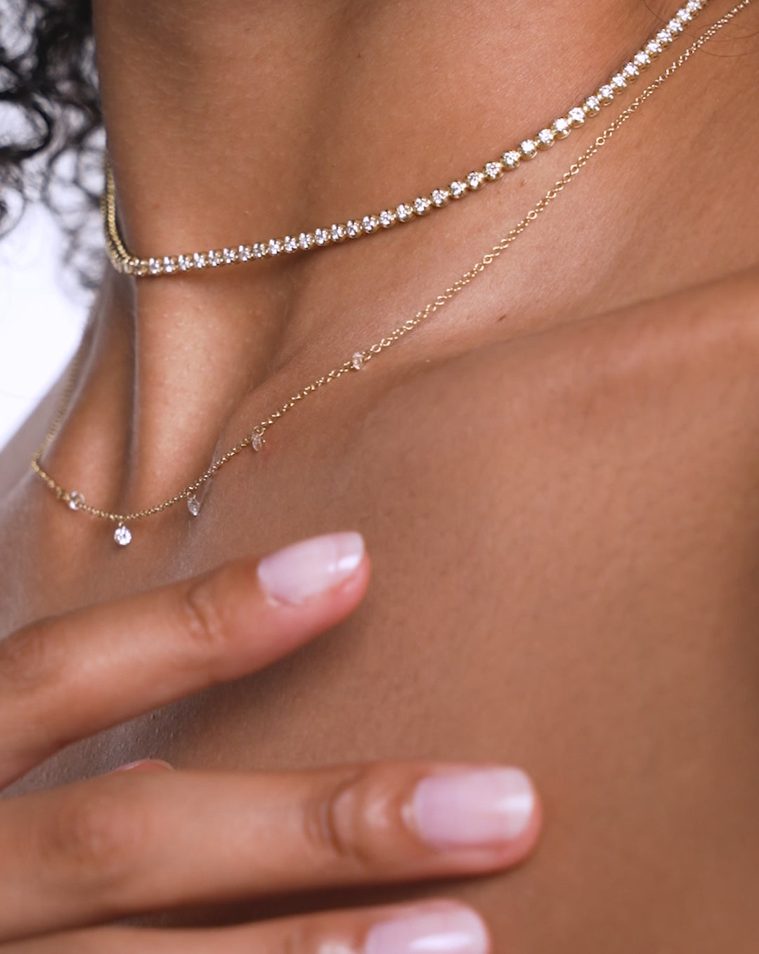 Video of Floating Diamond Necklace worn with the Multiway Diamond Tennis Necklace + Double Wrap Bracelet