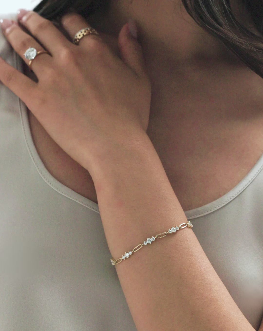 Video of model highlighting our Graduated Lab Diamond Chain Bracelet along with other tennis chain bracelets