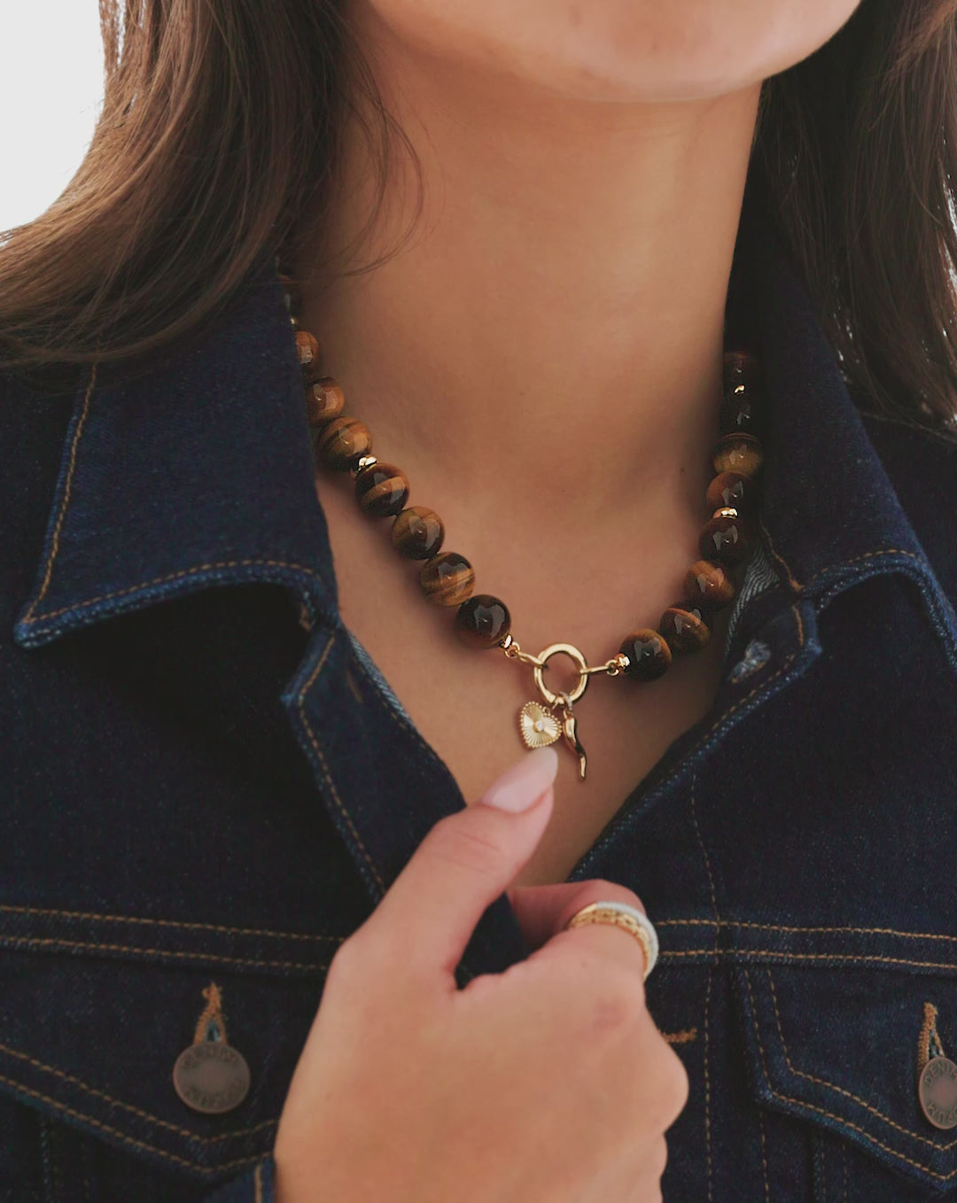 video of model wearing tiger's eye beaded necklace