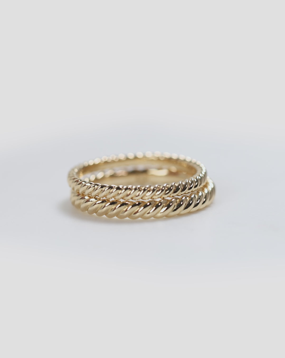 video of slim and classic stacked Twisted Wedding Band 14k Yellow Gold global