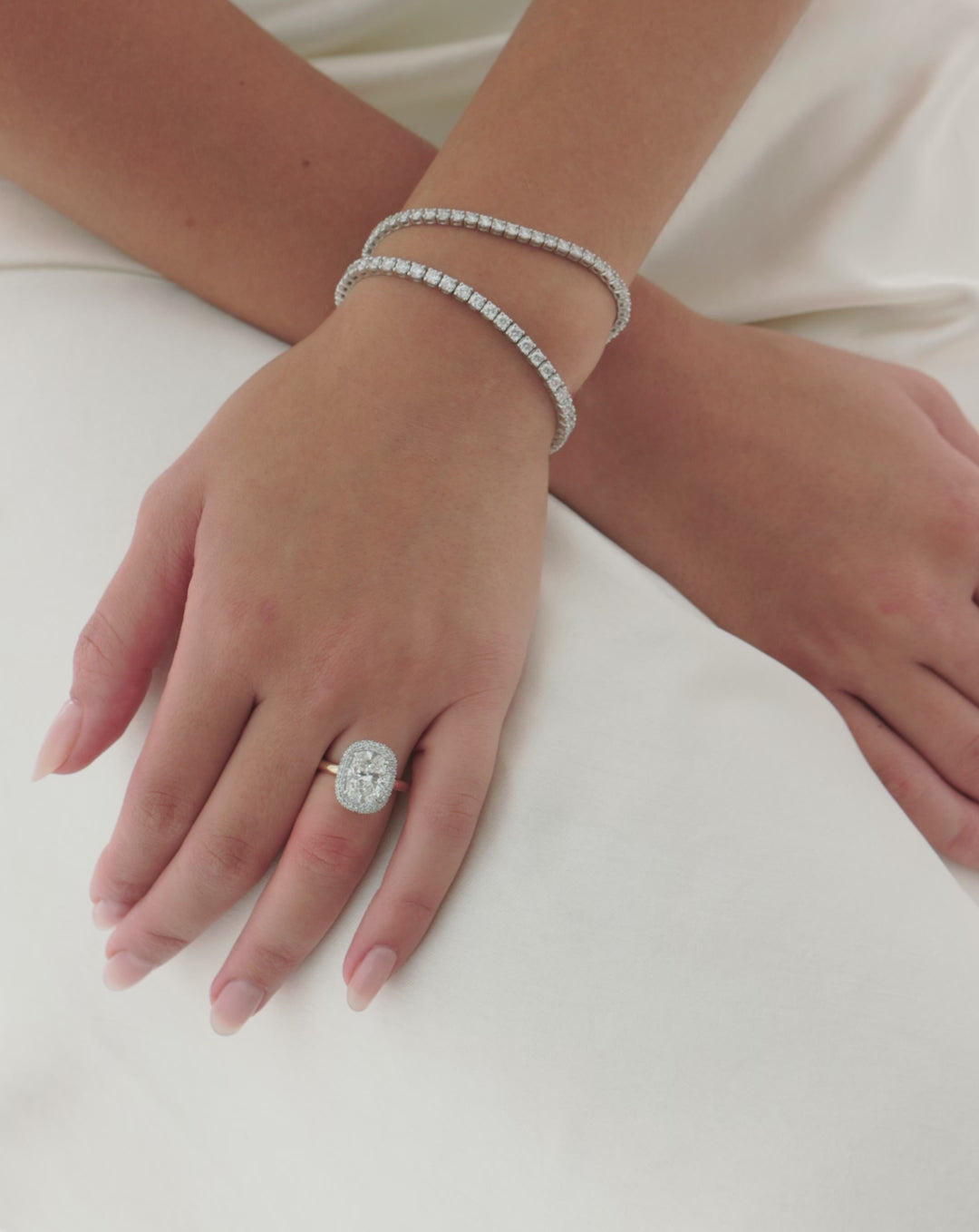 video of Cushion Cloud Bezel with Pavé Halo engagement ring shown on model  44830239424600 44830239031384 44830238736472 44181311979608 44181328461912 44181328494680