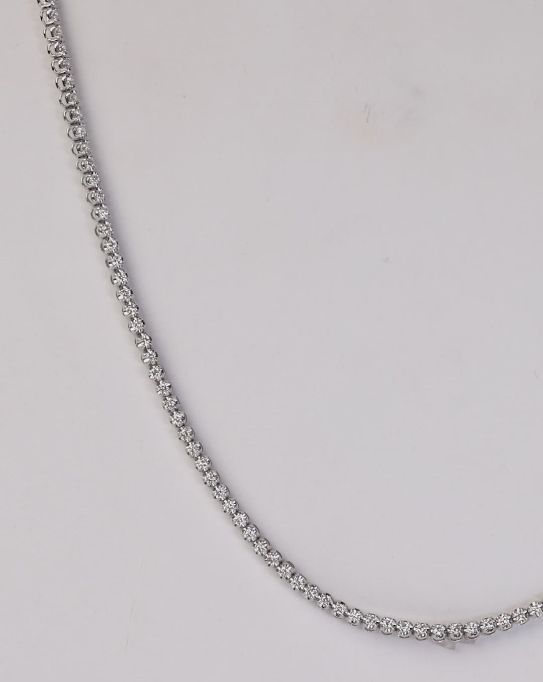 video of diamond tennis necklace and double wrap bracelet on model - global