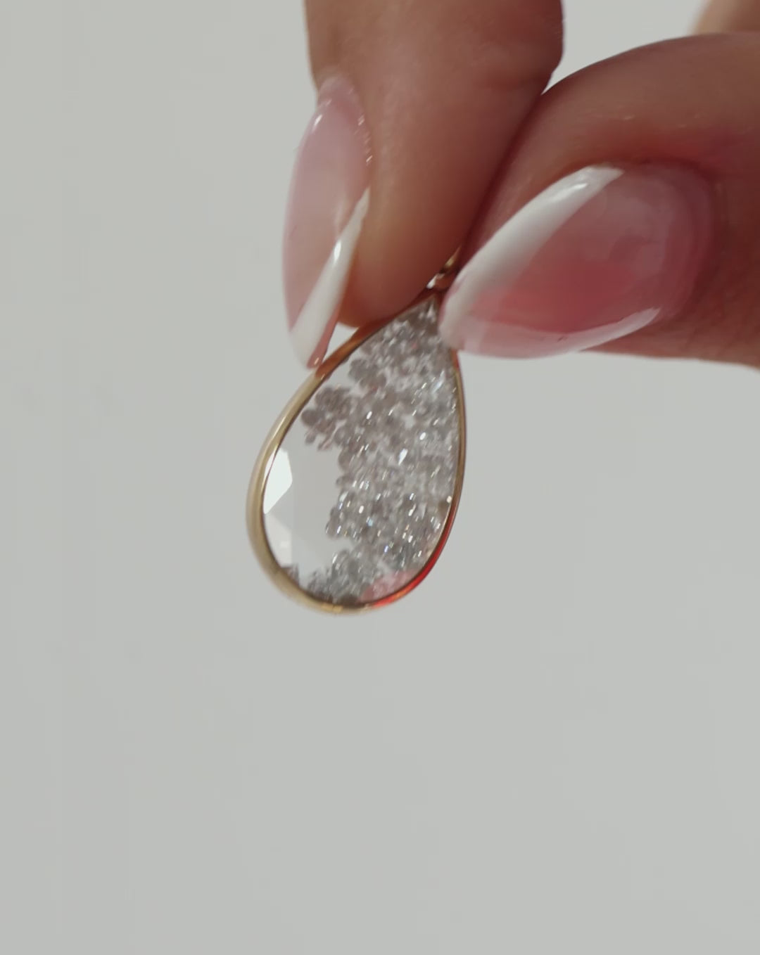 Video featuring different shots of our Shaker Pear Drop Earrings.