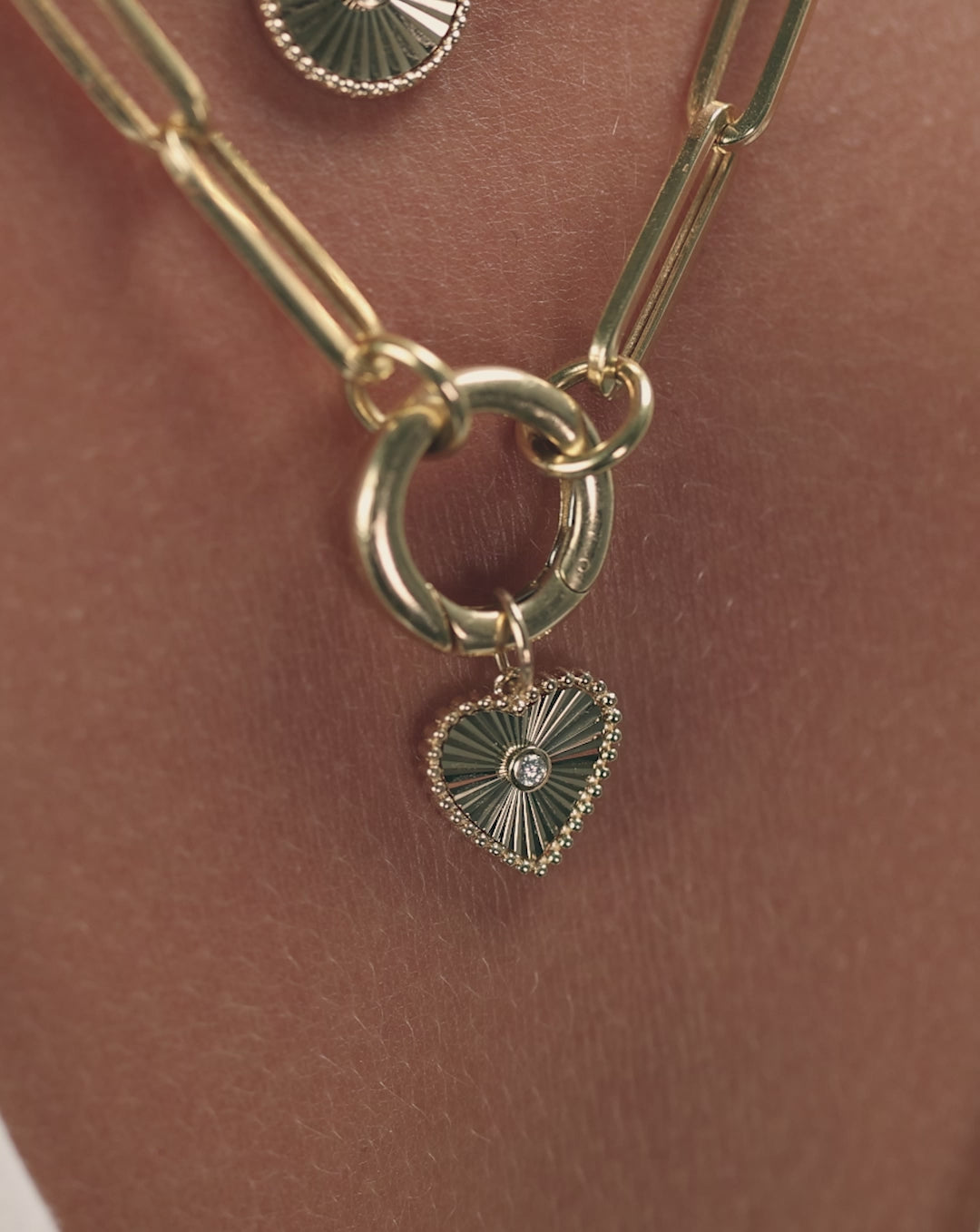 Video showcasing Fluted Heart Pendant from multiple angles, highlighting the dimensional fluted texture and elegant movement