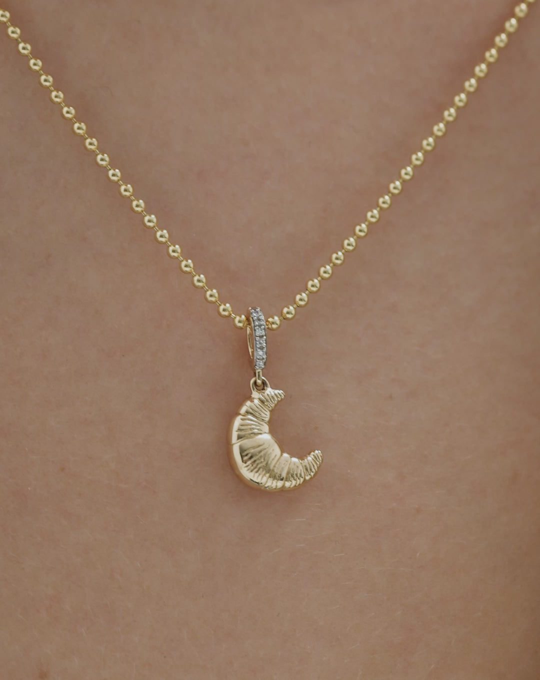 Video of 14k yellow gold Croissant Charm showing close up details