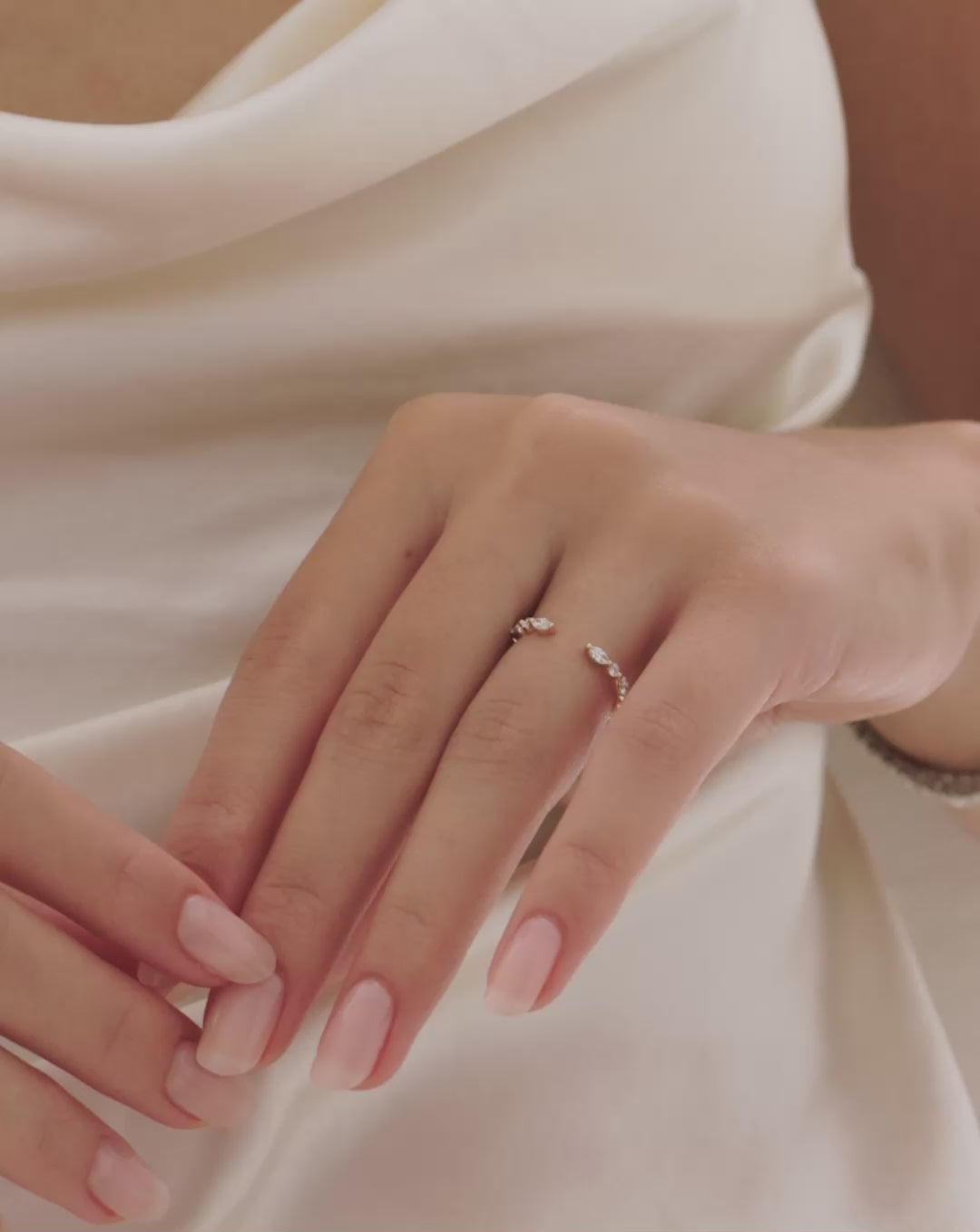 Video of a woman wearing the Marquise + Round Open Wedding band. 14k Yellow Gold 14k White Gold 14k Rose Gold Platinum 