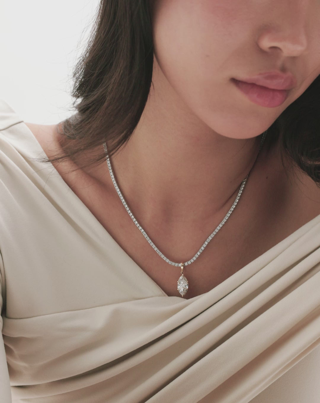 video of model wearing marquise diamond charm pendant on necklace