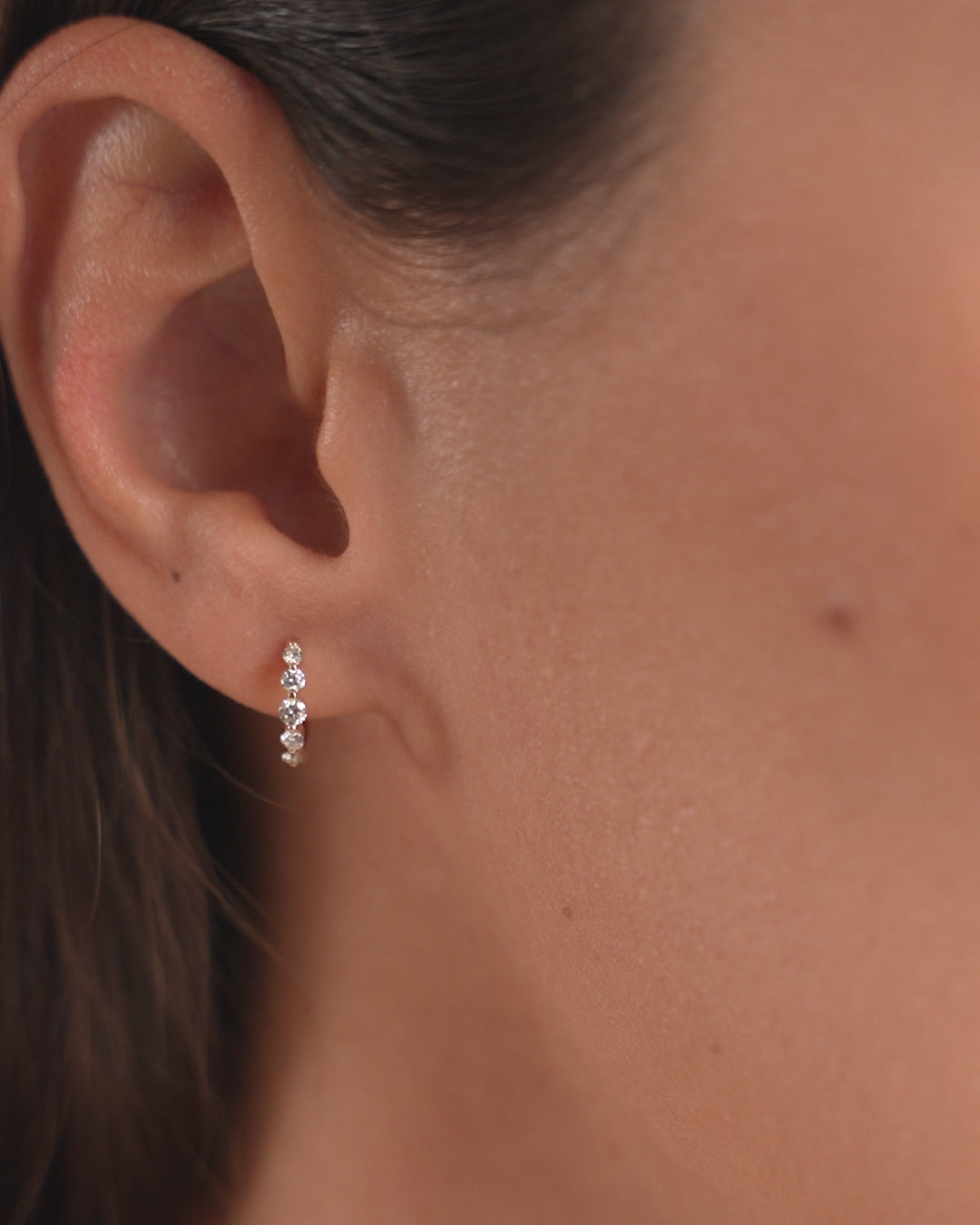 Video of Graduated Single Prong Diamond Huggies shown on ear 