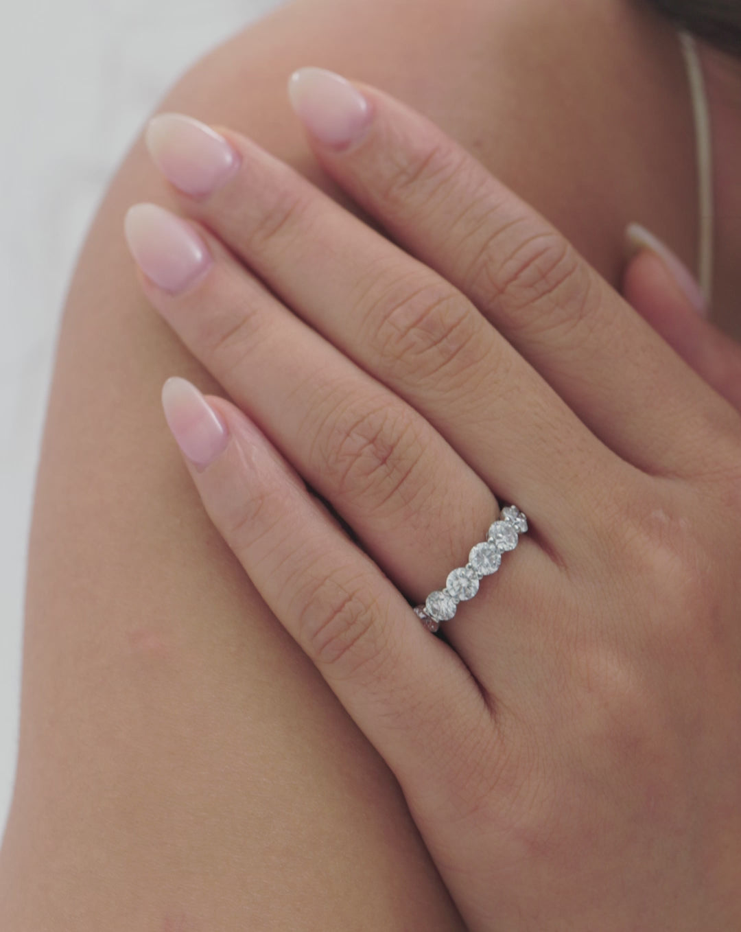 VIDEO video of model wearing round diamond and birthstone eternity band 
global