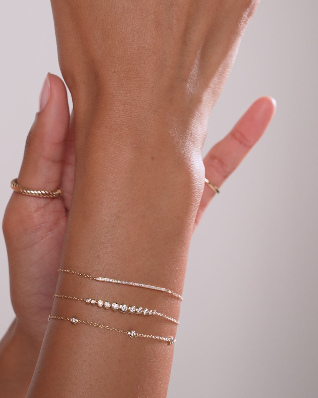 Video of Graduated Diamond Bezel Soft Chain Bracelet styled on wrist of model