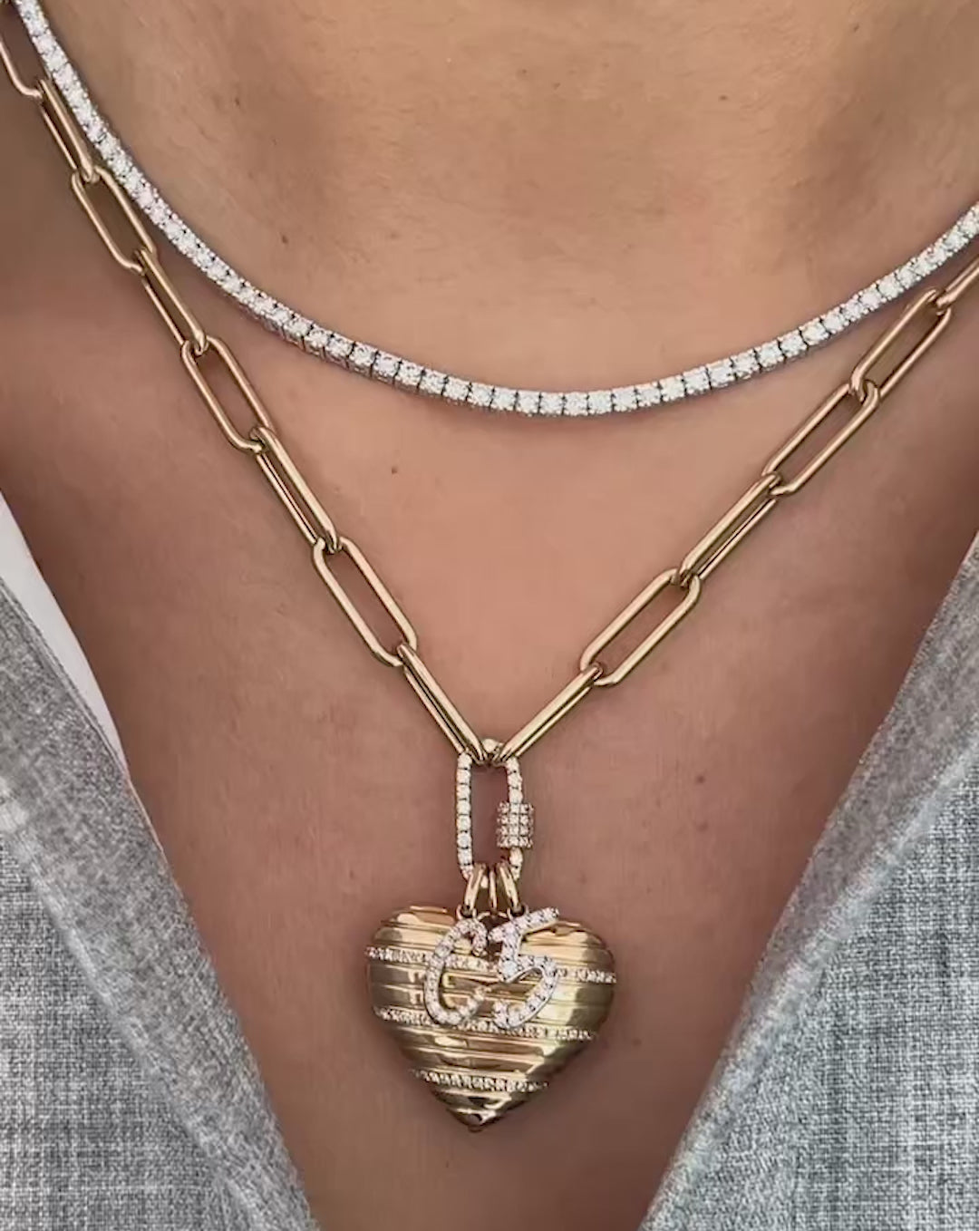 video of heart pendant with chain in yellow gold shown as bracelet and necklace