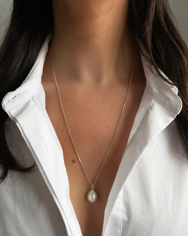 Ring Concierge Necklaces Long Organic Pearl Drop Necklace on 14K Yellow Gold chain - on model in white button-down top