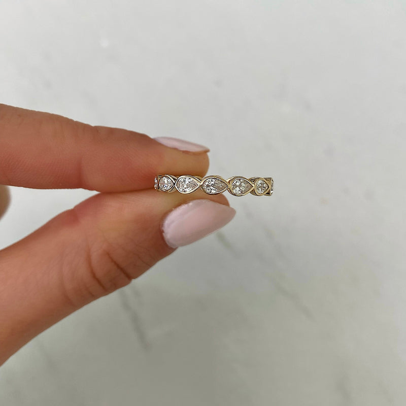 Bridal Wedding Bands Mini Pear Bezel Eternity Band - model holding ring