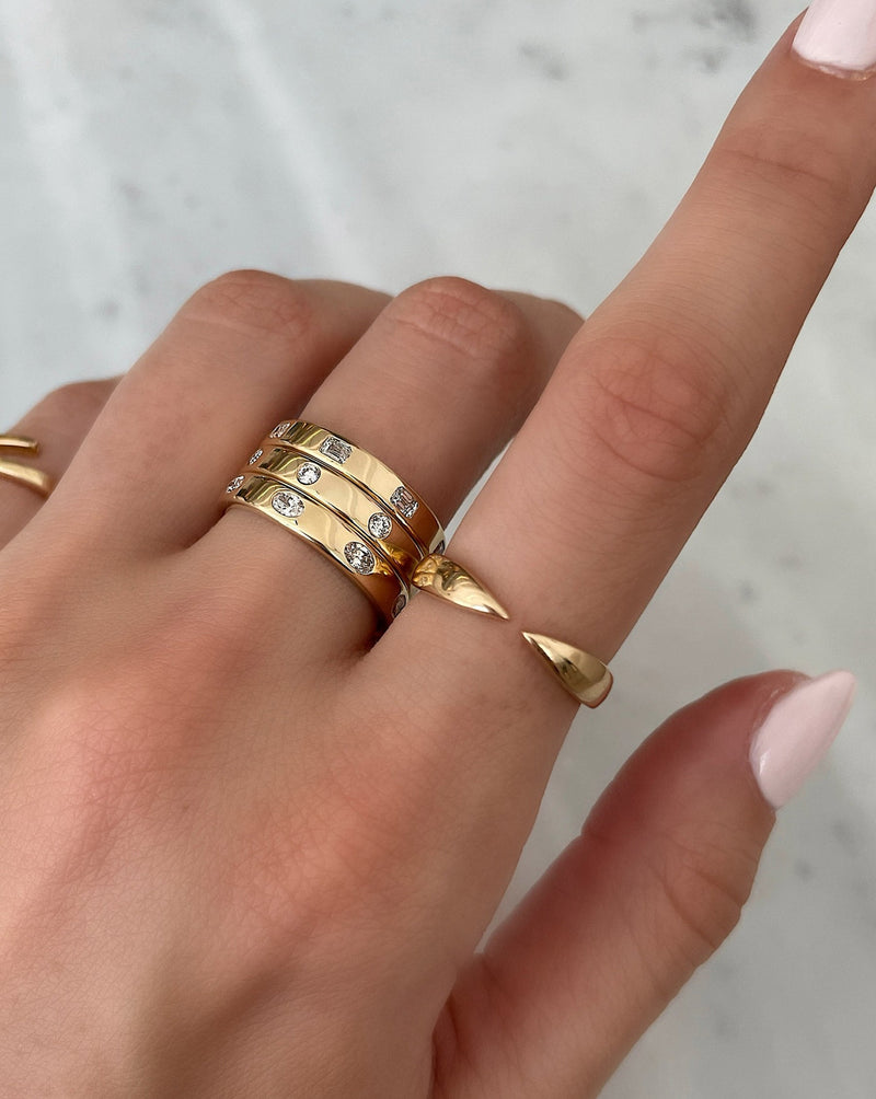 Bridal Wedding Bands Oval Luxe Inlay Eternity Band 3 rings stacked on middle finger with 2 other fine jewelry gold rings