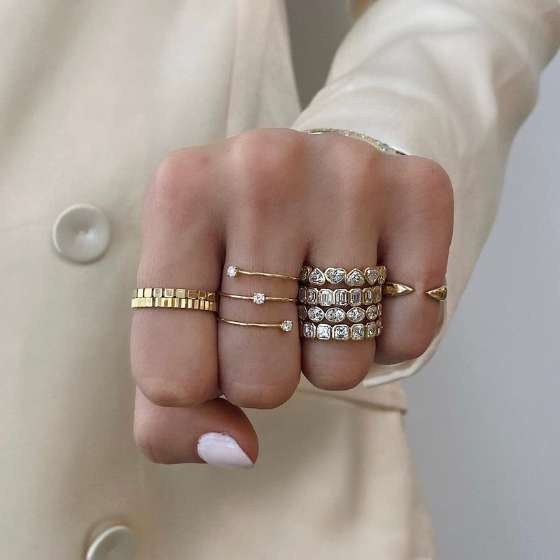 Bridal Wedding Bands Sideways Petite Oval Bezel Eternity Band 4 shapes stacked on pointer finger and model wearing white blazer and other fine jewelry rings