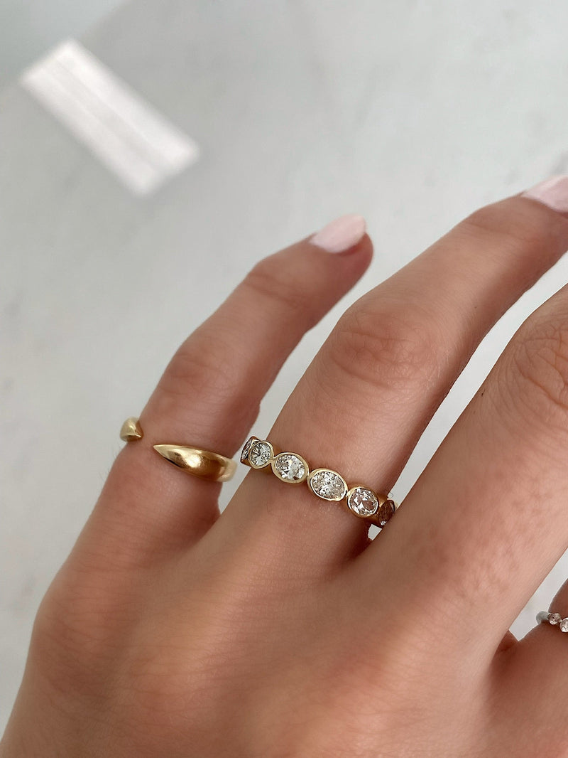 Bridal Wedding Bands Sideways Petite Oval Bezel Eternity Band on model