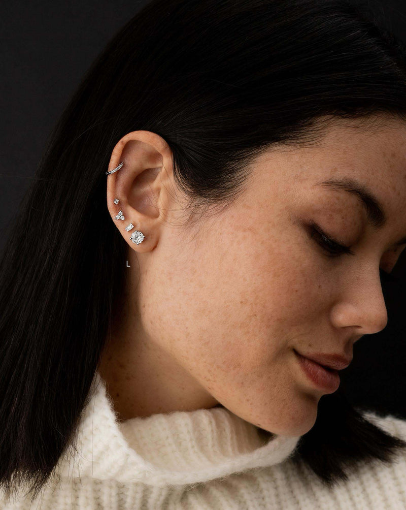 Ring Concierge Earrings Round Illusion Diamond Studs on model paired with ear cuff and small studs.