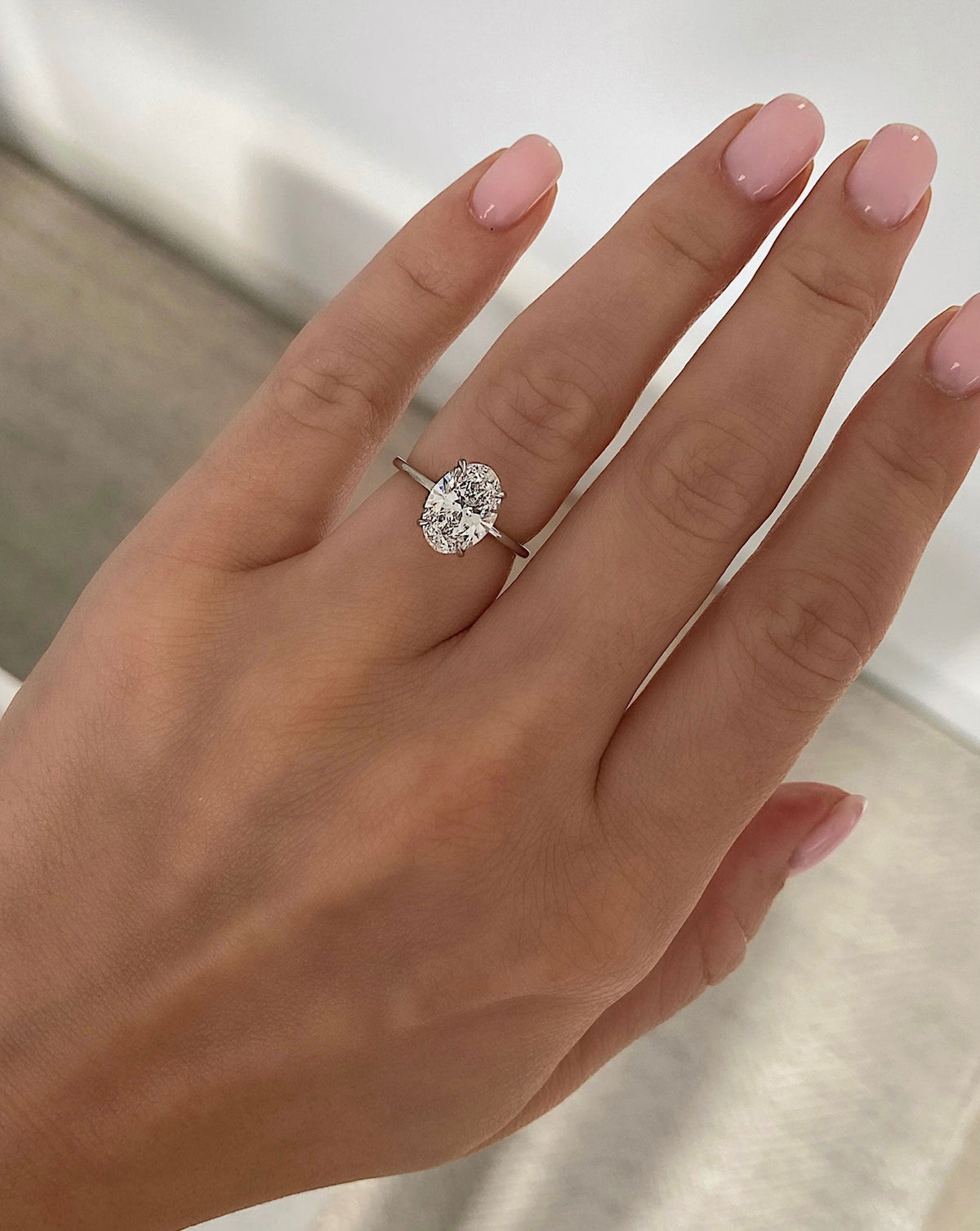 3.55 Oval Lab Diamond in Whisper Thin® Hidden Halo shown on model