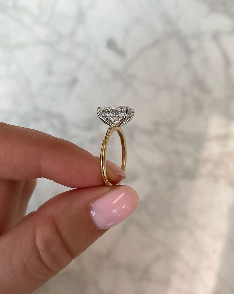 Ring Concierge Lab Grown Engagement Rings Oval Lab Diamond Ring hand holding ring from side