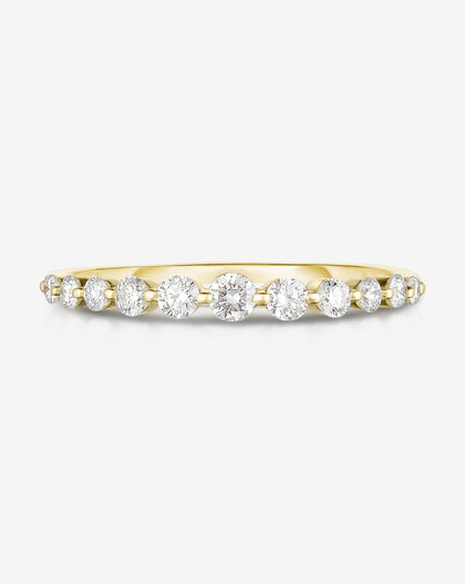 Flat lay of Ring Concierge 14k Yellow Gold / 4.5 Graduated Single Prong Diamond Ring