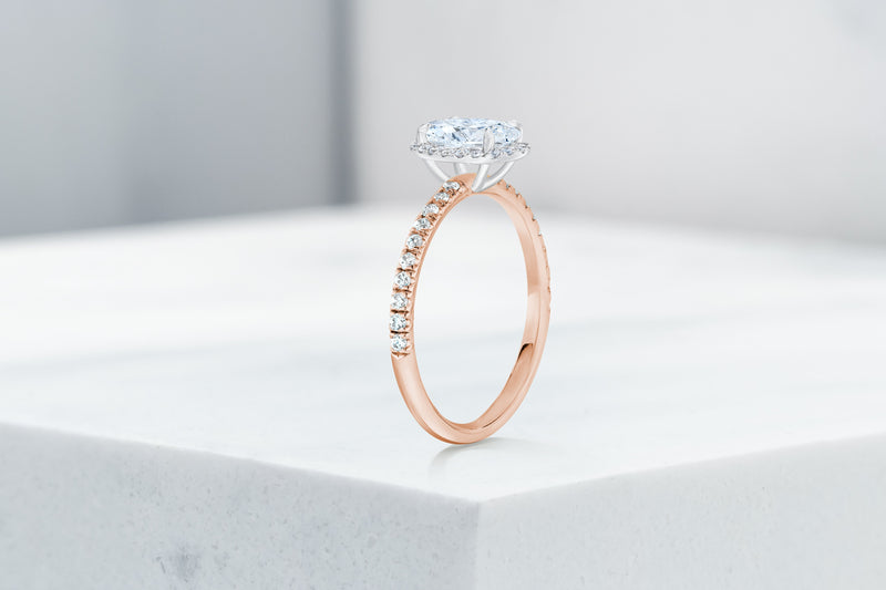 Delancey VOW by Ring Concierge oval halo micropave engagement ring in rose gold. 33281357316184