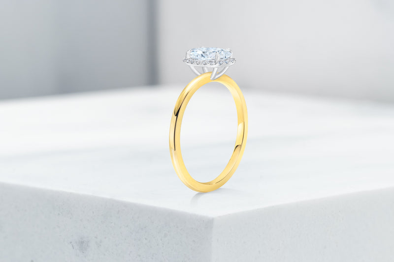 Essex VOW by Ring Concierge oval halo engagement ring with plain band in yellow gold. 33281380679768