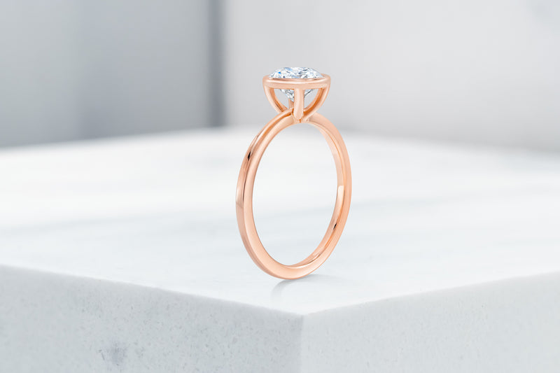 Mercer VOW by Ring Concierge round bezel engagement ring in rose gold. 33281413742680