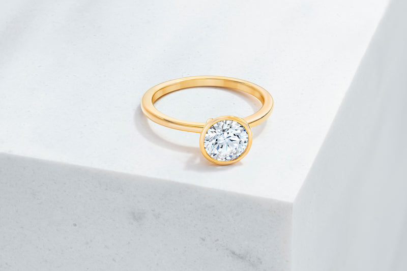 Mercer VOW by Ring Concierge round bezel engagement ring in yellow gold. 33281413709912