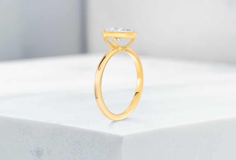 Mercer VOW by Ring Concierge pear bezel engagement ring in yellow gold. 33281414103128